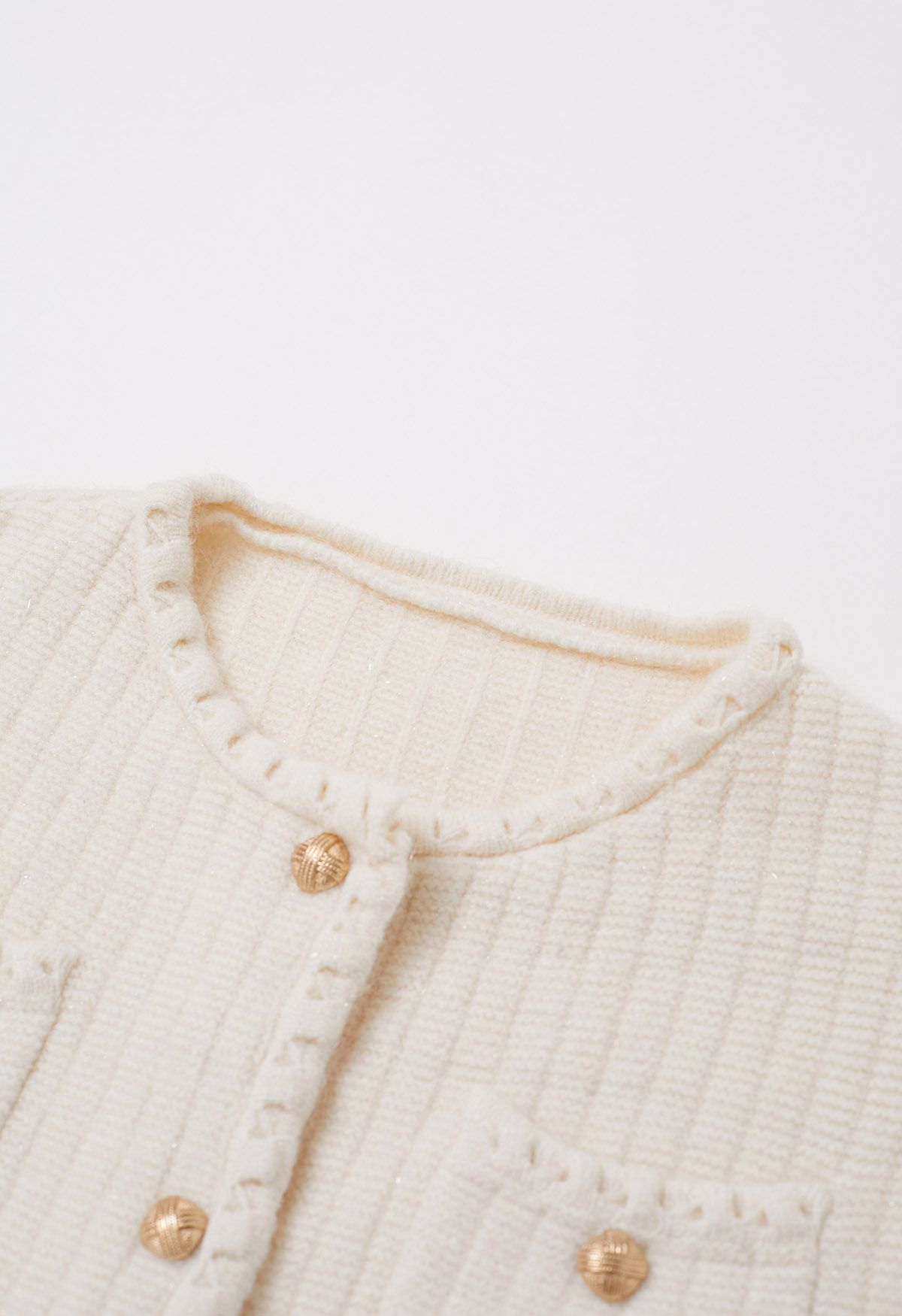 Cardigan boutonné en tricot à bordures à franges brillantes en crème