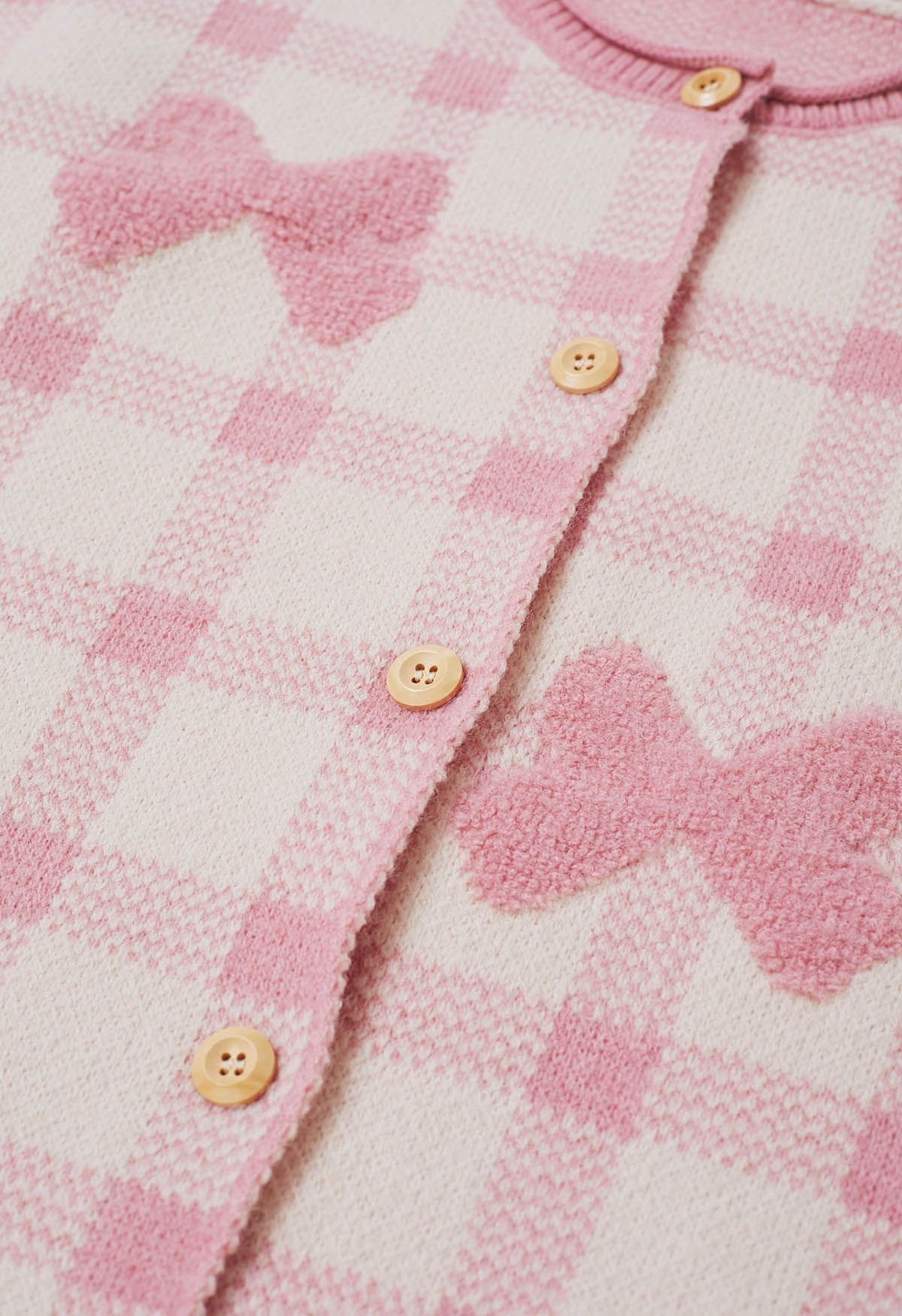 Cardigan boutonné en tricot à carreaux jacquard avec nœud papillon en rose