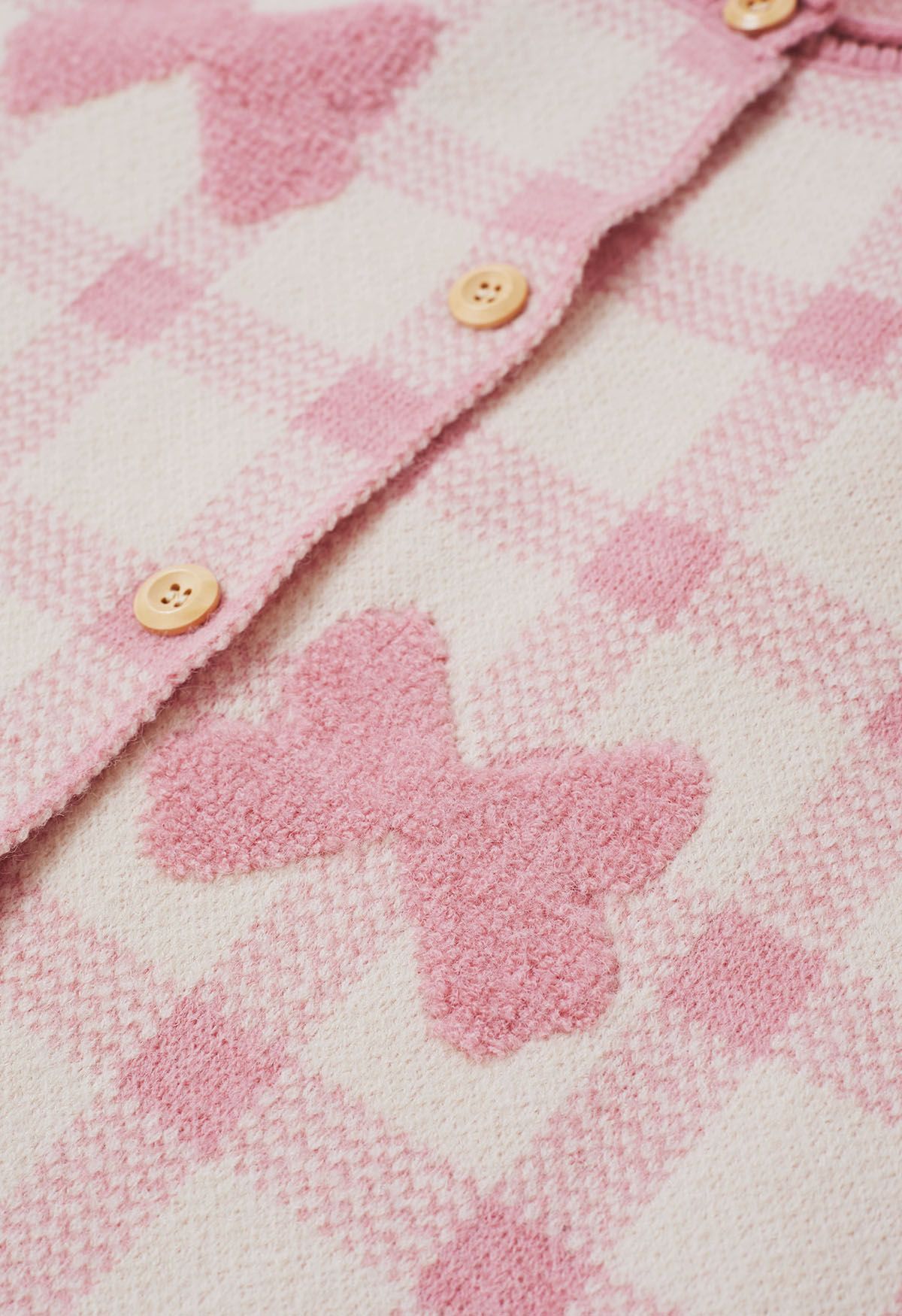 Cardigan boutonné en tricot à carreaux jacquard avec nœud papillon en rose