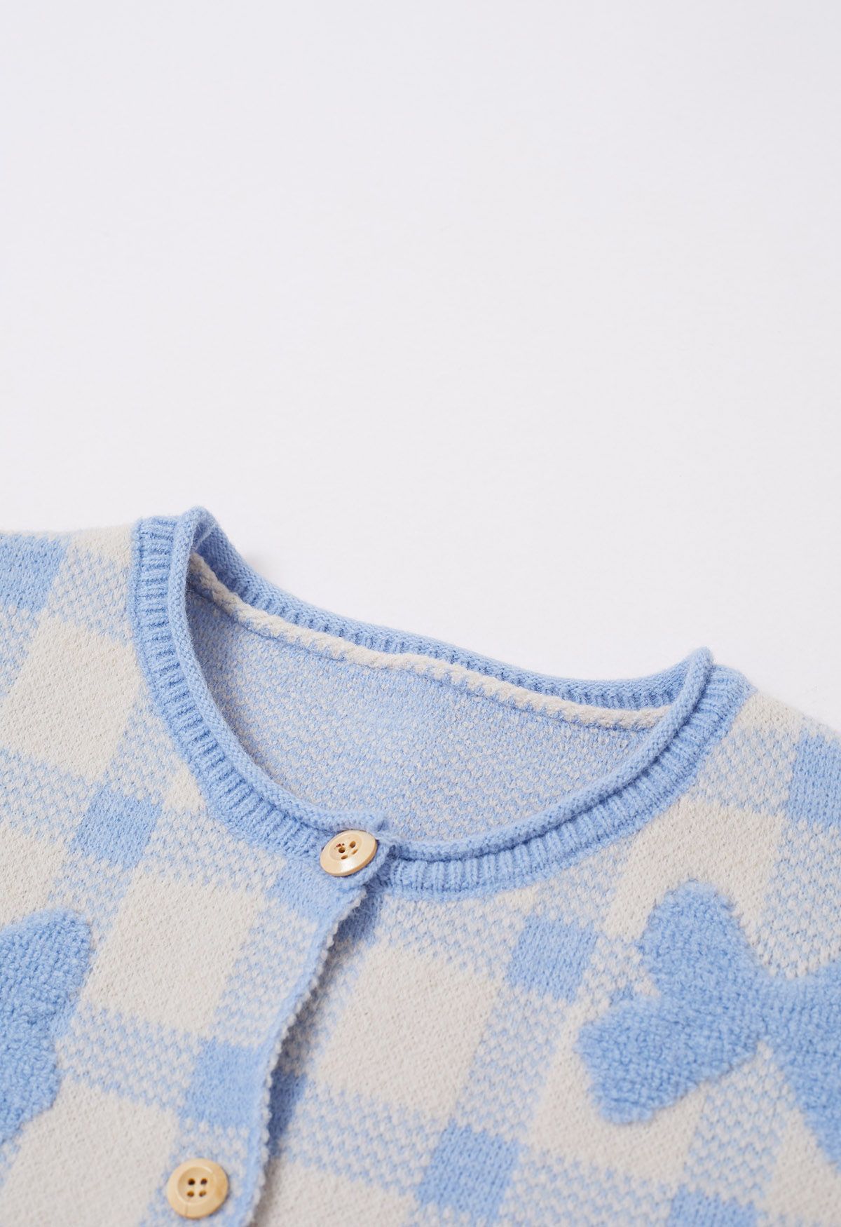 Cardigan boutonné en tricot à carreaux jacquard avec nœud papillon en bleu bébé