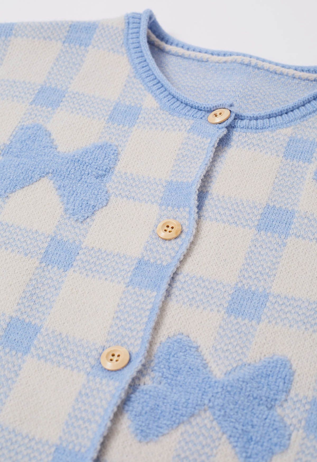 Cardigan boutonné en tricot à carreaux jacquard avec nœud papillon en bleu bébé