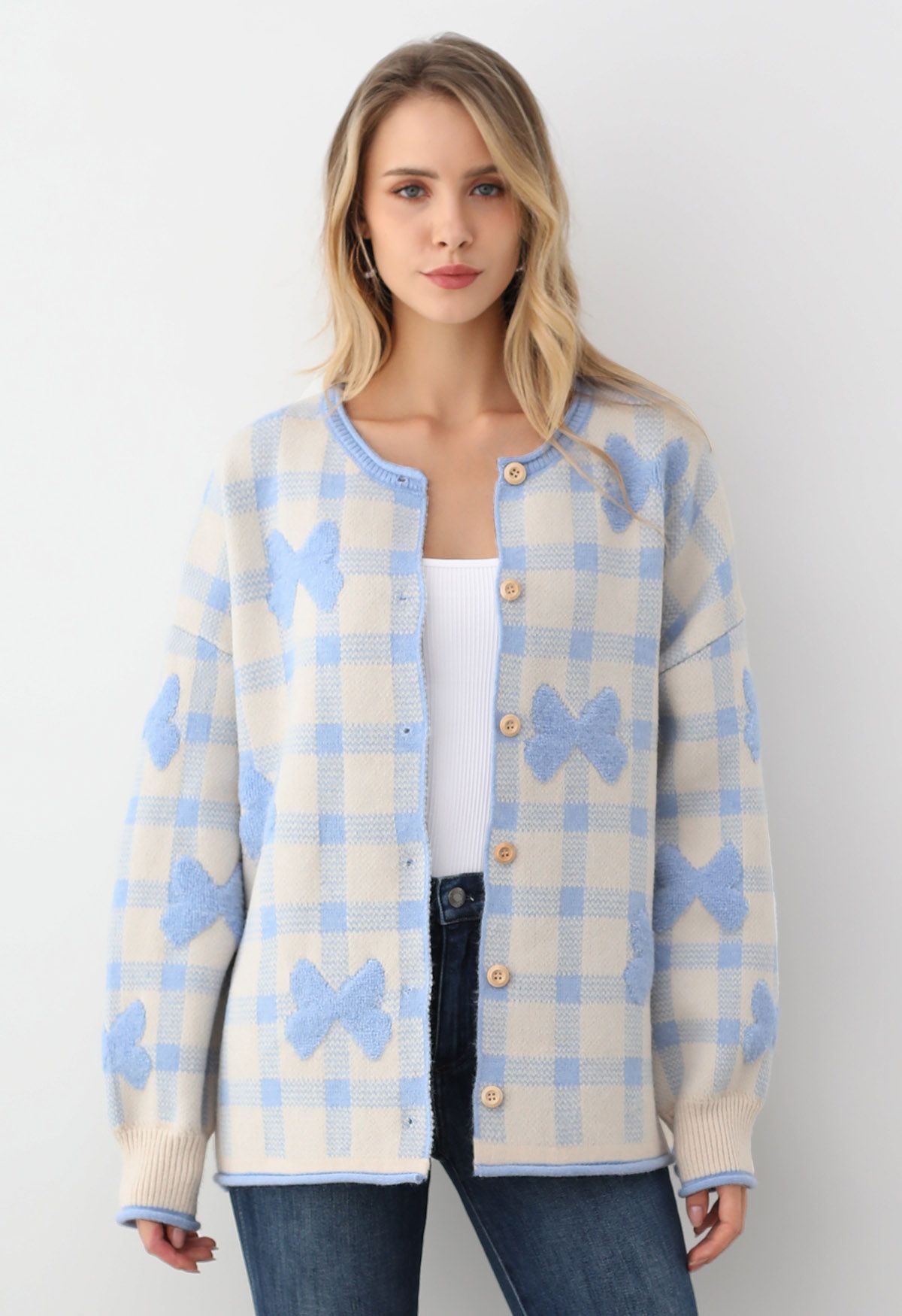 Cardigan boutonné en tricot à carreaux jacquard avec nœud papillon en bleu bébé