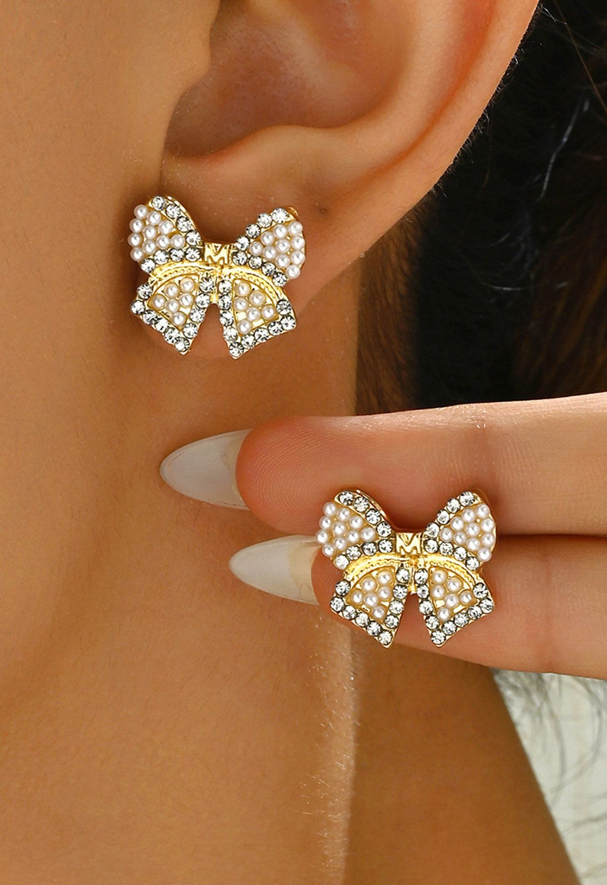 Boucles d'oreilles en forme de nœud avec perles et strass