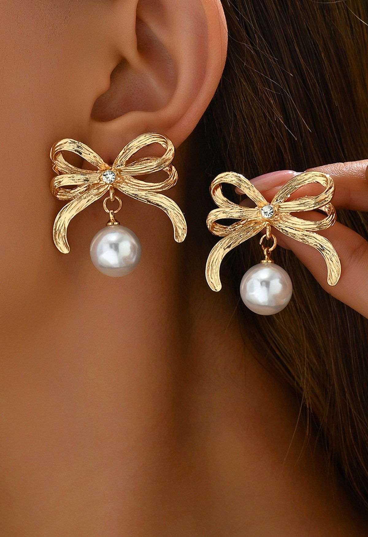 Boucles d'oreilles à double couche avec nœud papillon et perles en or