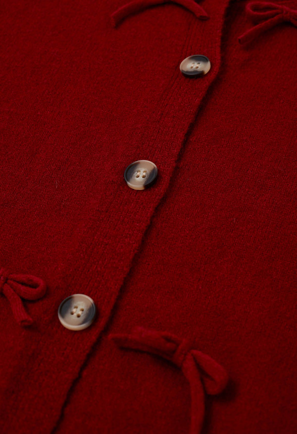 Adorable cardigan en tricot boutonné avec nœud papillon en rouge