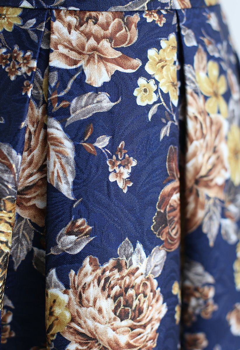 Jupe mi-longue plissée à fleurs vintage en bleu marine