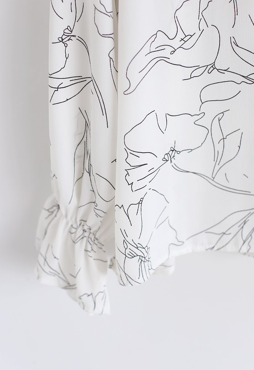 Haut en mousseline à volants à fleurs abstraites en blanc