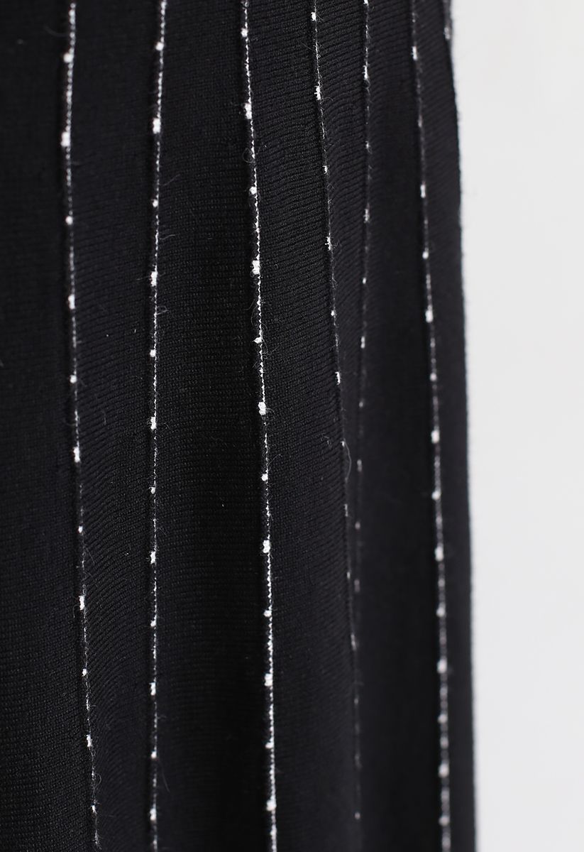 Jupe mi-longue trapèze en tricot rayé en noir