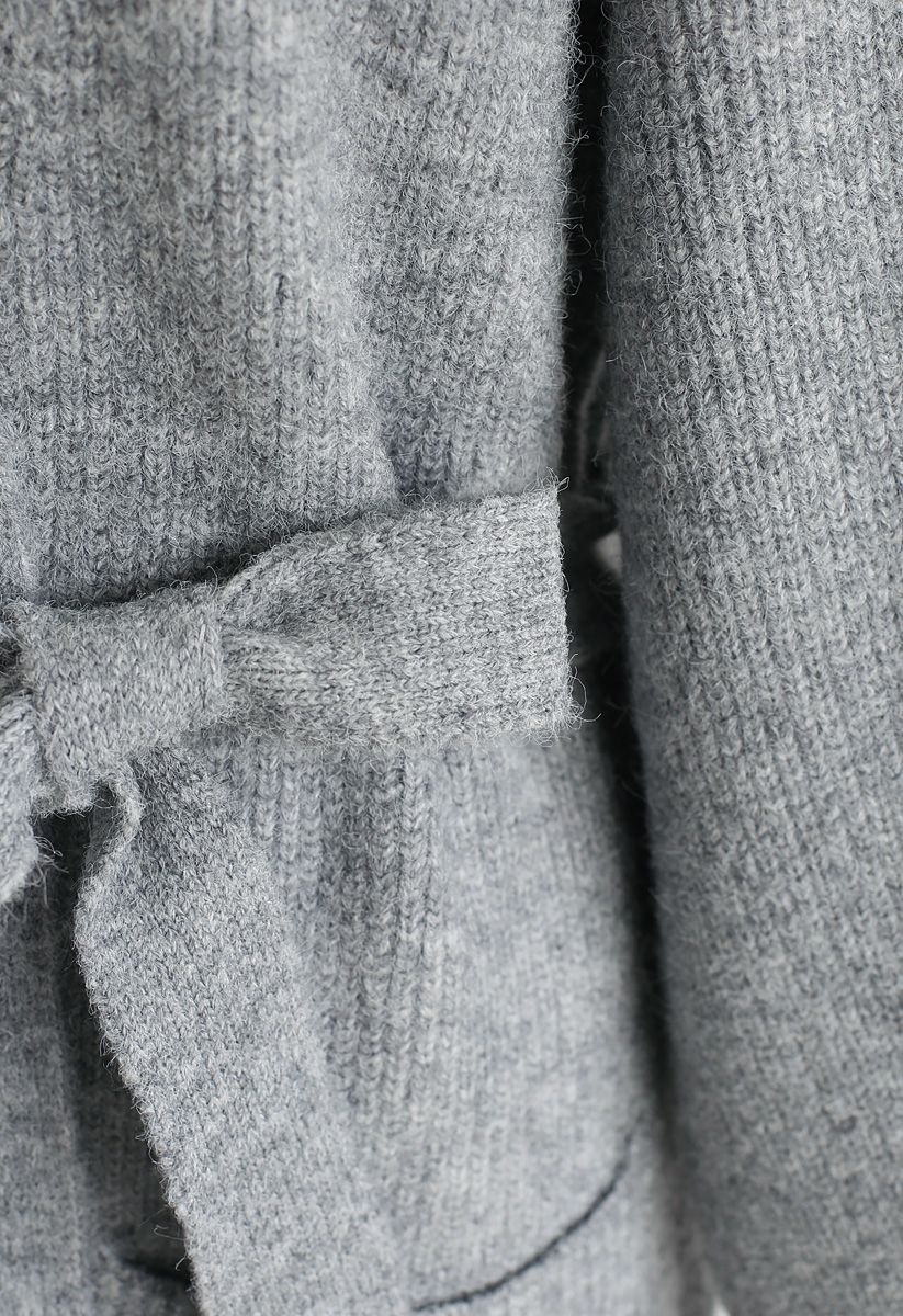 Cardigan ouvert en tricot avec poches à ceinture en gris
