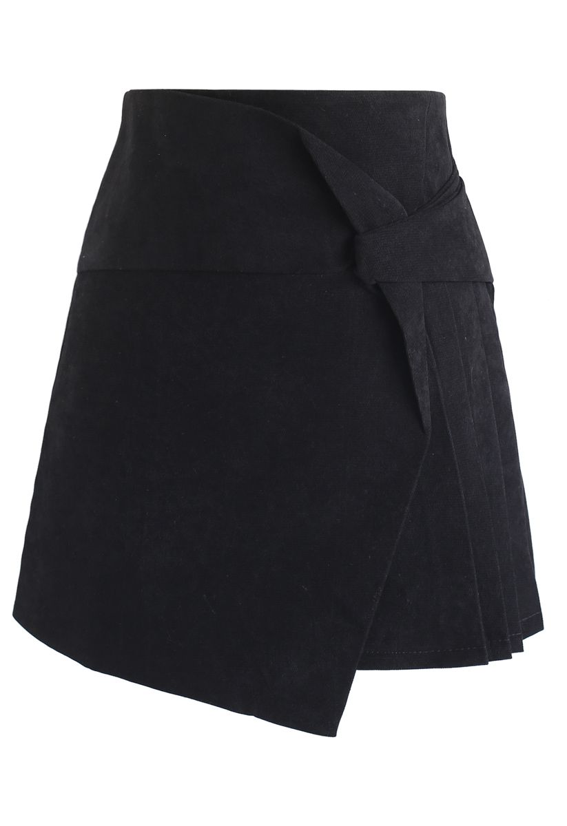 Mini jupe plissée à rabat en noir