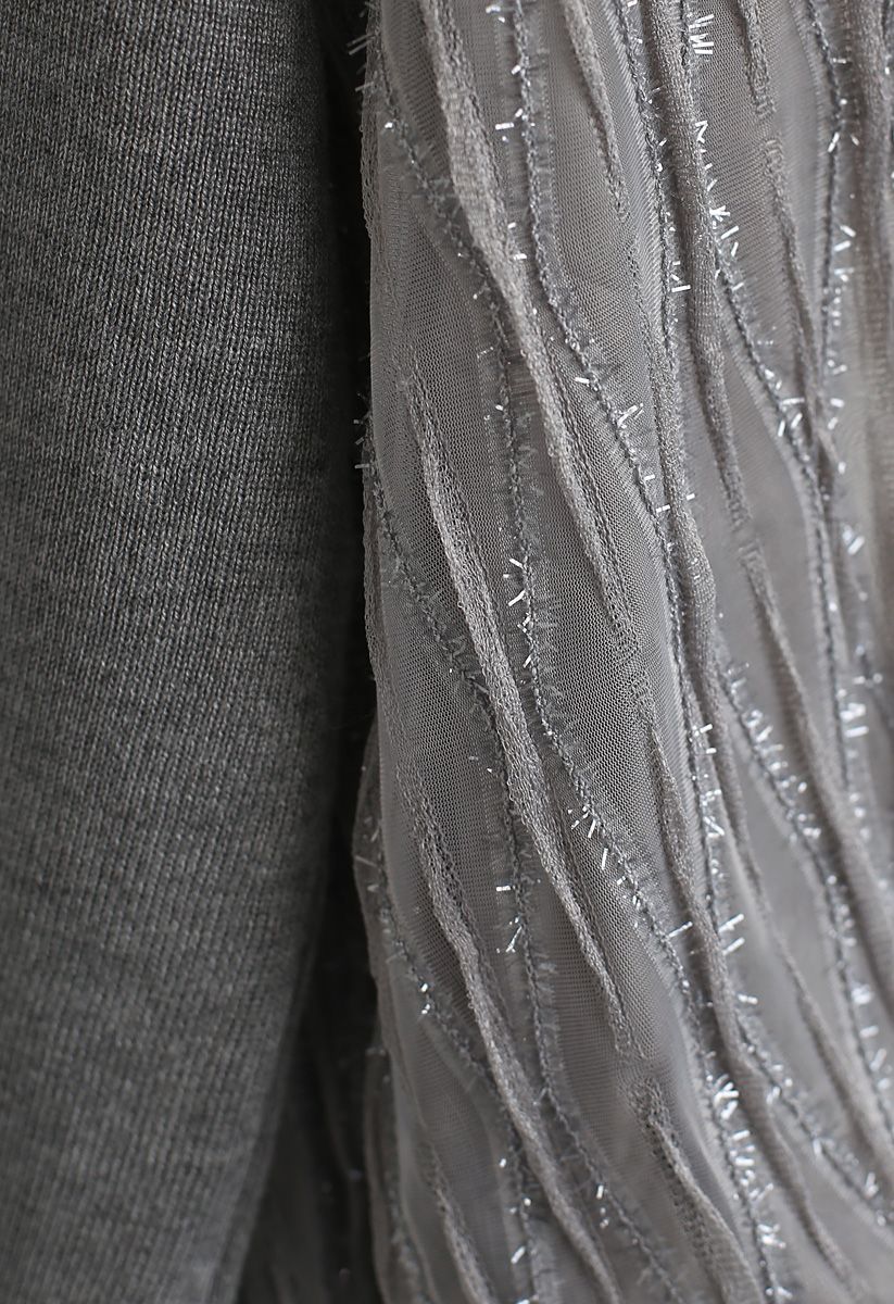 Haut en tricot à manches bouffantes et lignes brillantes en gris