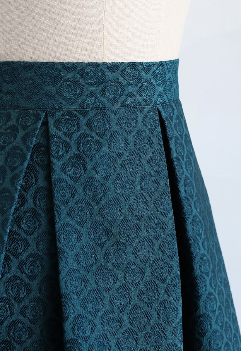 Jupe mi-longue plissée en jacquard rose turquoise