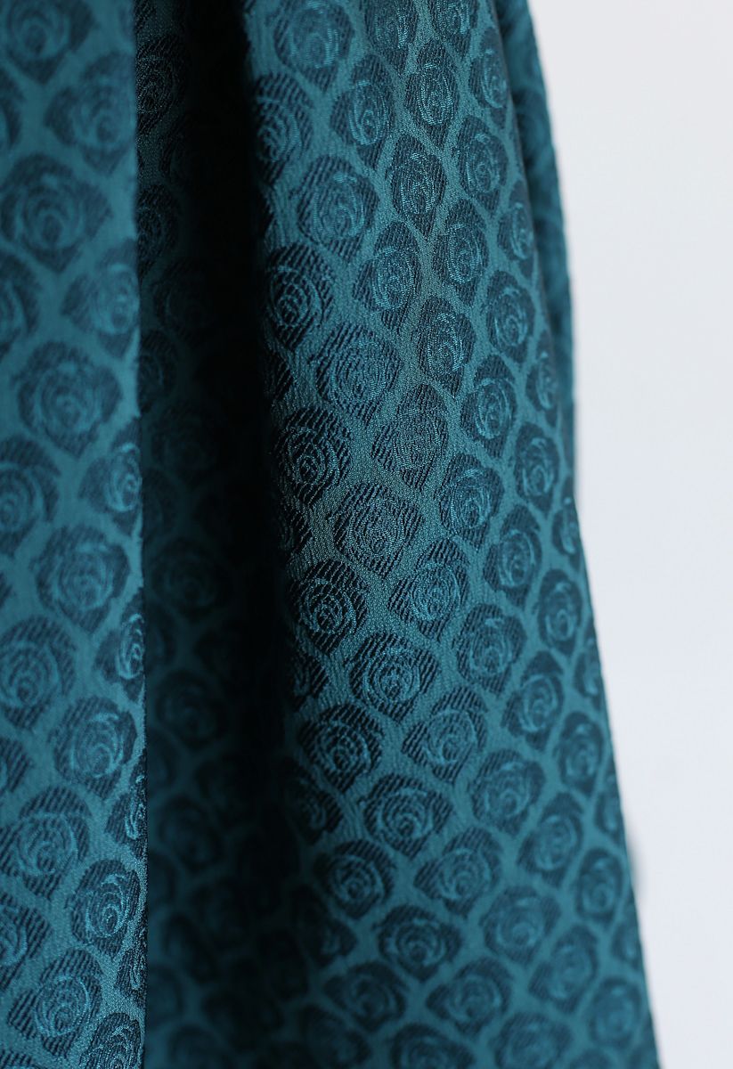Jupe mi-longue plissée en jacquard rose turquoise