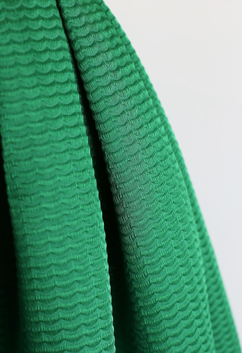 Jupe mi-longue plissée à texture ondulée en vert