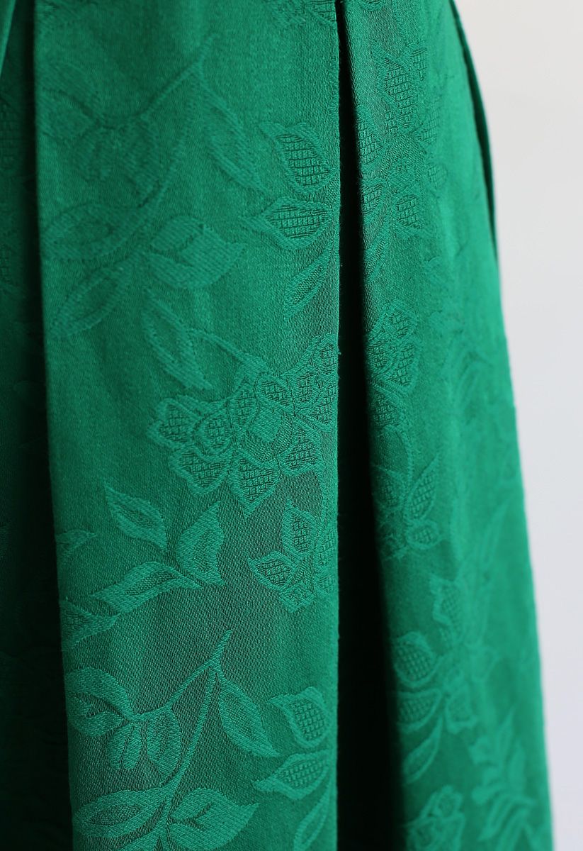 Jupe mi-longue verte plissée en jacquard fleuri