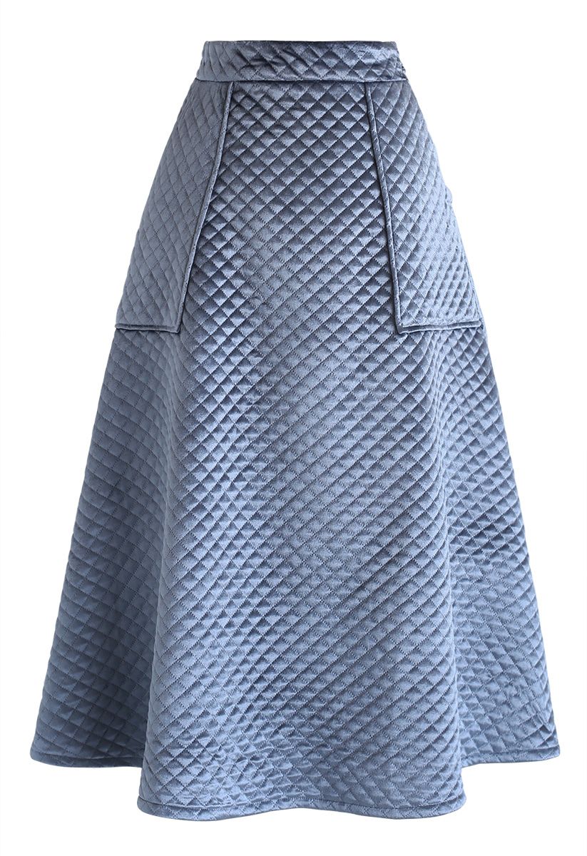 Jupe mi-longue trapèze en velours matelassé avec poches en bleu poussiéreux