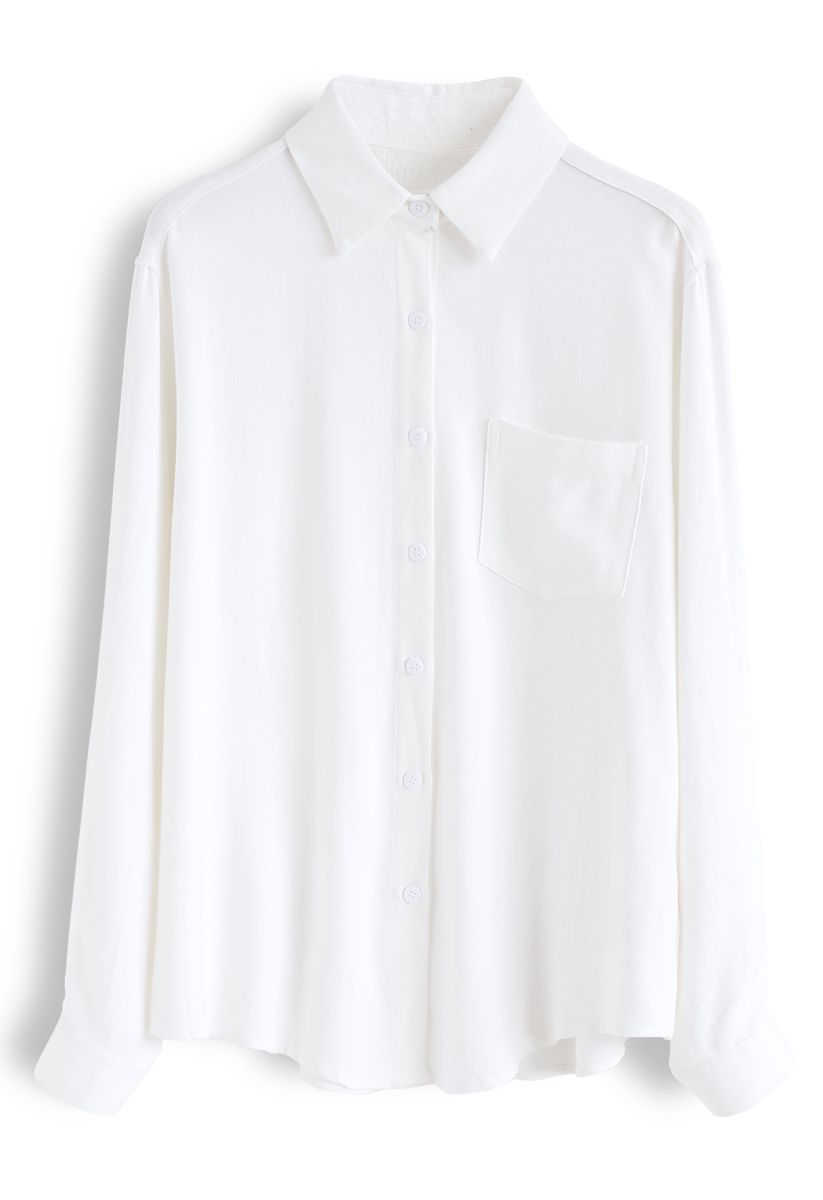 Chemise à manches boutonnées avec poche en blanc