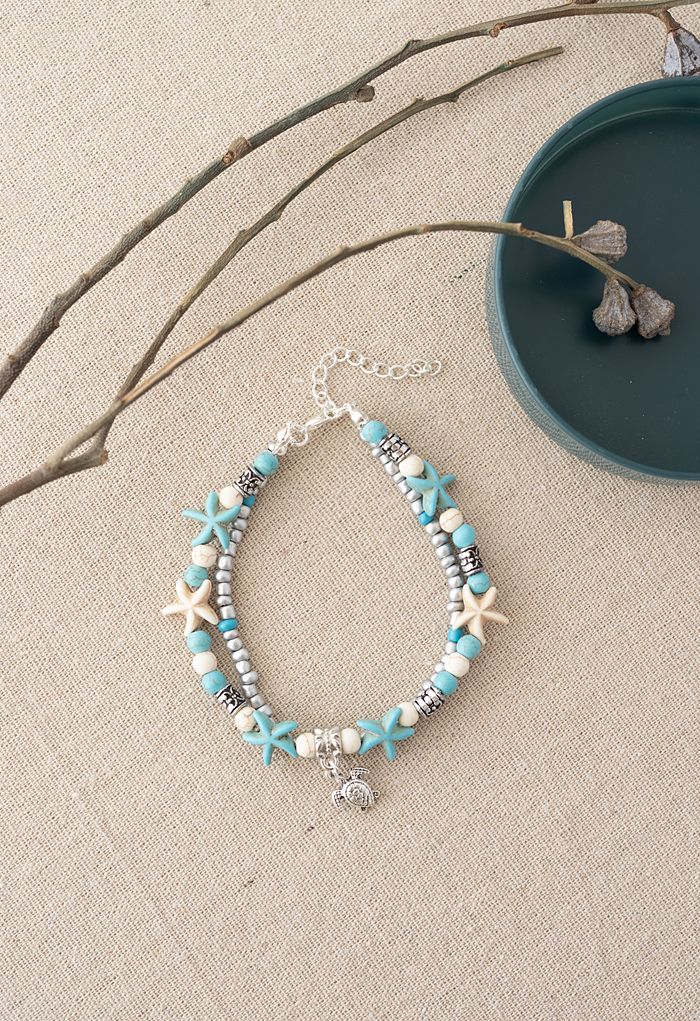 Bracelet de perles d'étoiles de mer bleues superposées