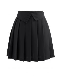 Mini-jupe plissée à taille pliée et boutonnée en noir