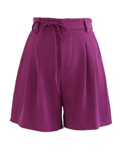 Short à poche latérale avec cordon à nouer en violet