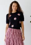 Haut en tricot à manches courtes et fleurs roses en noir