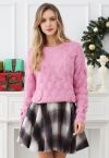 Pull en tricot texturé géométrique à nœud ludique en rose