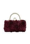 Pochette opulente avec poignée en strass rose en bordeaux