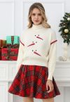 Pull en tricot gaufré à col roulé et broderie bonhomme de neige ludique