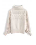 Pull en tricot à col roulé avec détails frangés en crème