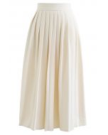 Jupe mi-longue plissée demi-côté couleur unie en ivoire
