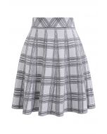 Mini-jupe taille haute en tricot à carreaux en gris