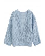 Cardigan en maille ajouré ouvert sur le devant en bleu