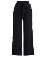Pantalon en tricot à jambe droite avec franges latérales en noir