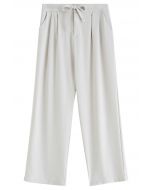 Pantalon plissé à taille avec cordon de serrage en ivoire