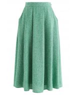 Jupe mi-longue plissée en tweed avec poche latérale
