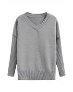 Pull en tricot ample à épaules tombantes et fente latérale en gris