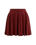 Mini-jupe plissée à taille élastique en rouge