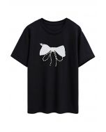T-shirt orné de perles à motif nœud papillon en noir