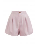 Short boutonné doré avec poche latérale en rose