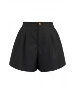 Short boutonné doré avec poche latérale en noir