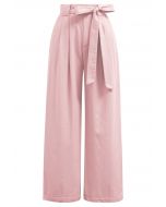 Pantalon large plissé avec ceinture à nœud papillon en rose