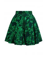 Mini-jupe plissée en jacquard floral vert