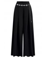 Pantalon Palazzo plissé orné de chaînes en noir