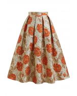 Jupe mi-longue plissée évasée en jacquard fleuri orné de motifs orange