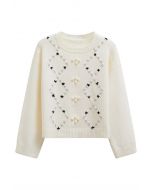 Pull côtelé à pompons et à motifs floraux en losanges, couleur crème