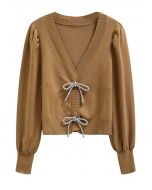 Cardigan en tricot boutonné à manches lanternes et nœud papillon scintillant en camel