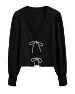 Cardigan en tricot boutonné à manches lanternes et nœud papillon scintillant en noir