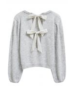 Pull en tricot à manches bouffantes et nœud dans le dos en gris