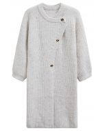 Cardigan long en tricot boutonné asymétrique enveloppé de chaleur en blanc