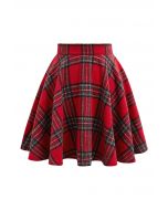 Mini-jupe évasée à motif tartan et charme festif en rouge